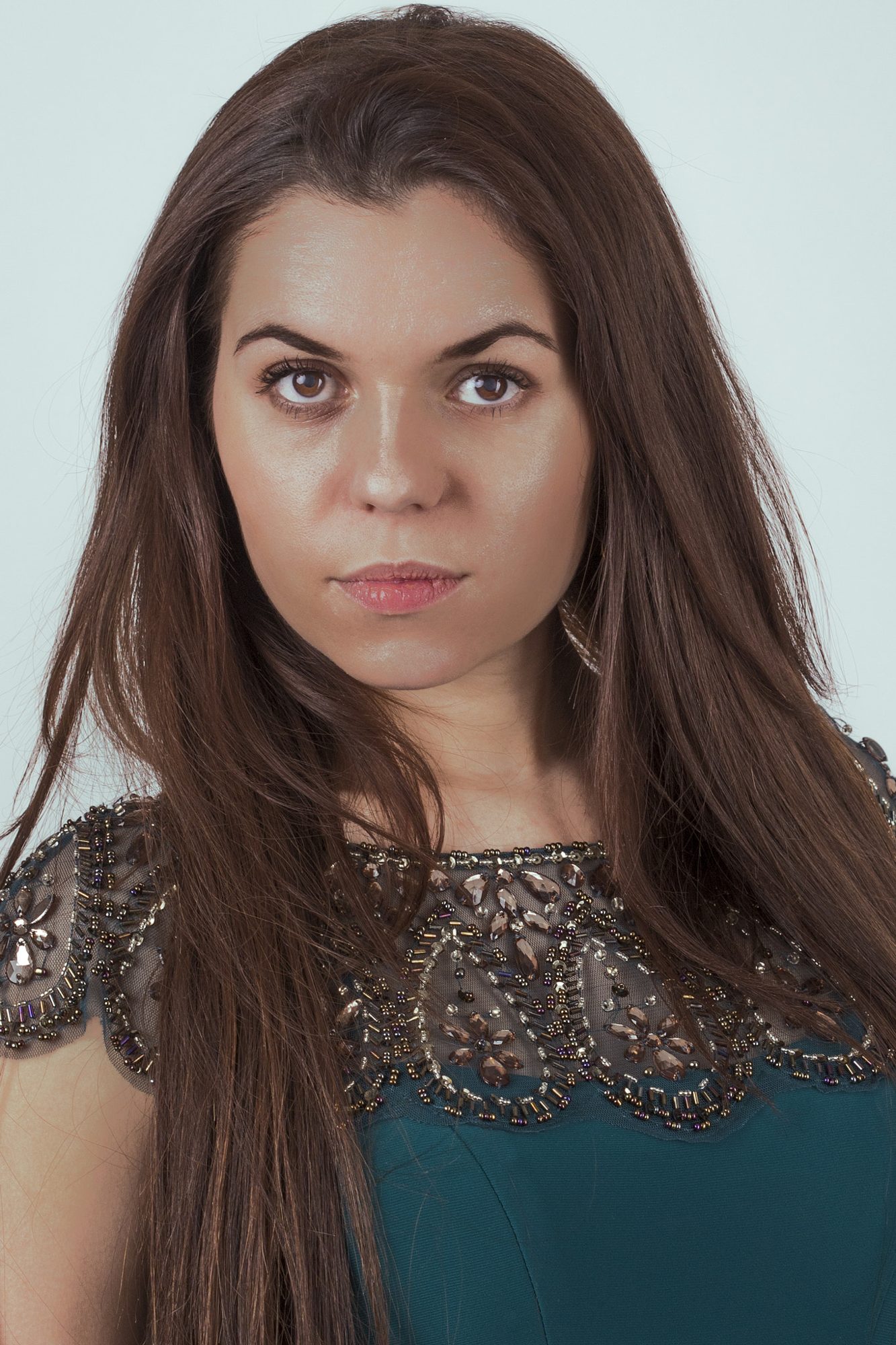 Portrait in teal and lace, direct eye contact