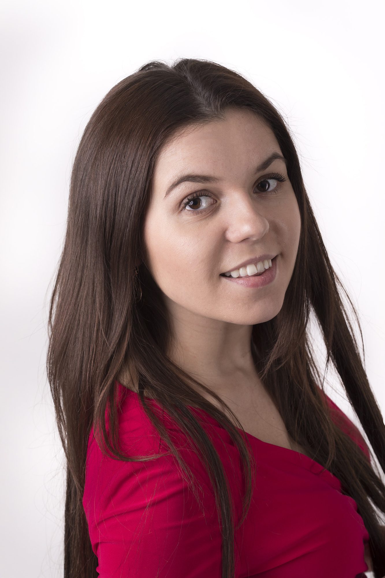 Smiling portrait glancing over the shoulder