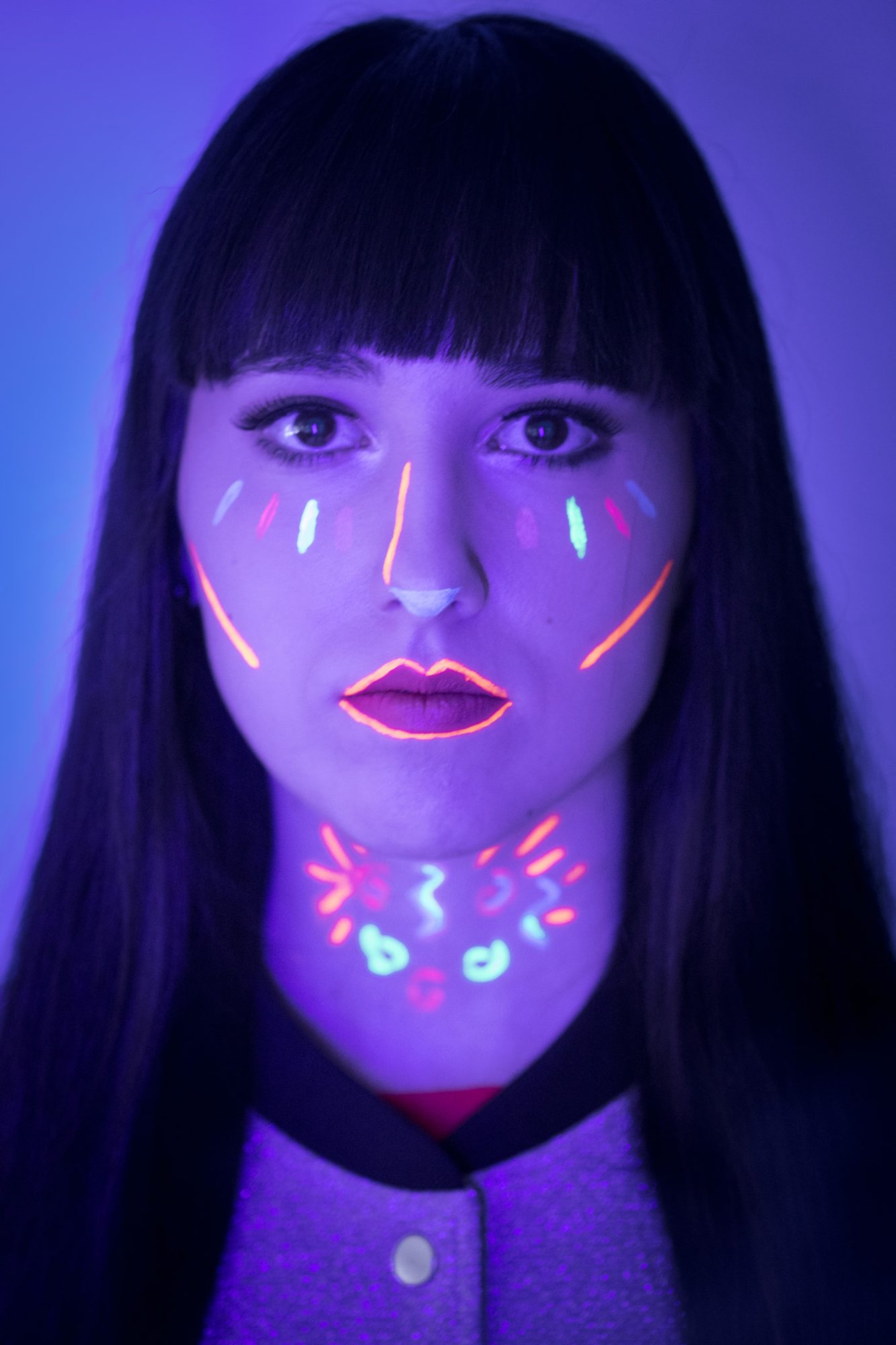 UV blacklight portrait with fluorescent face paint