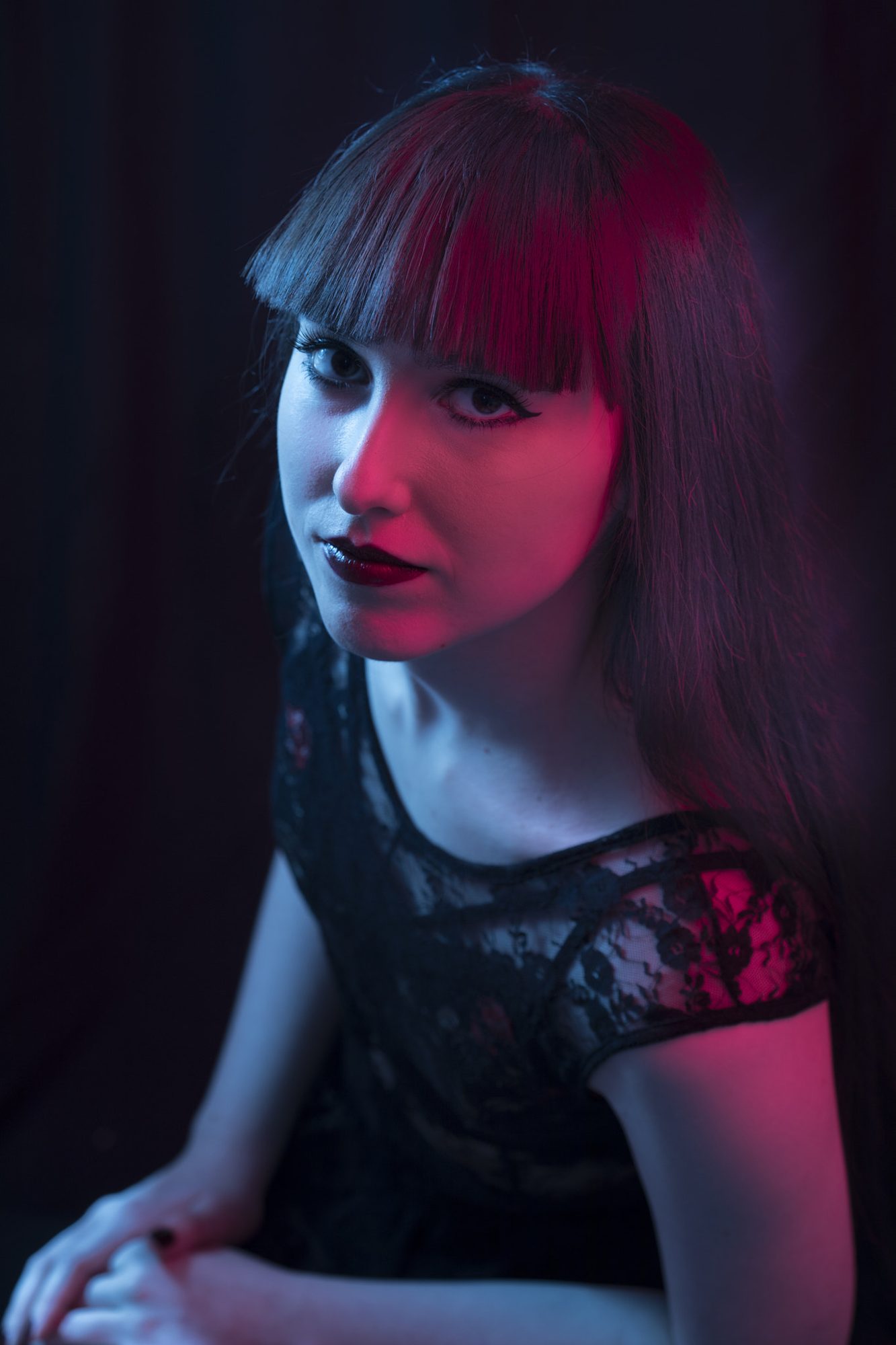 Portrait lit with red and blue gels