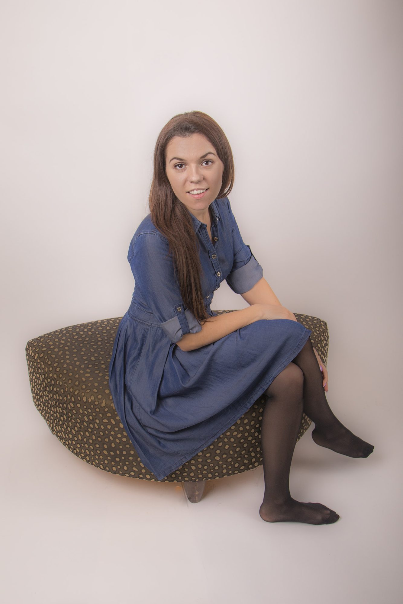 Seated portrait in blue dress