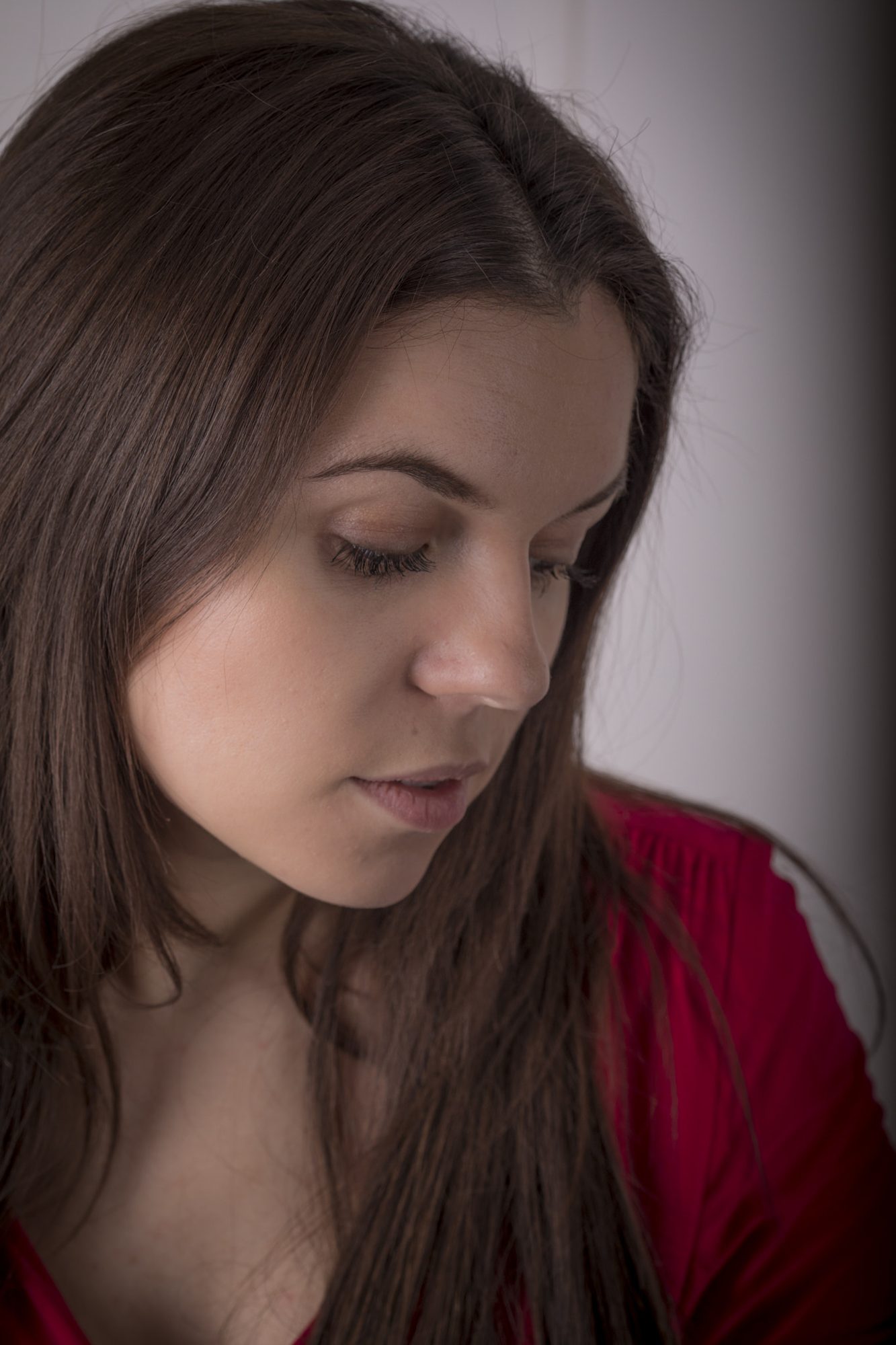 Portrait looking down in warm low light