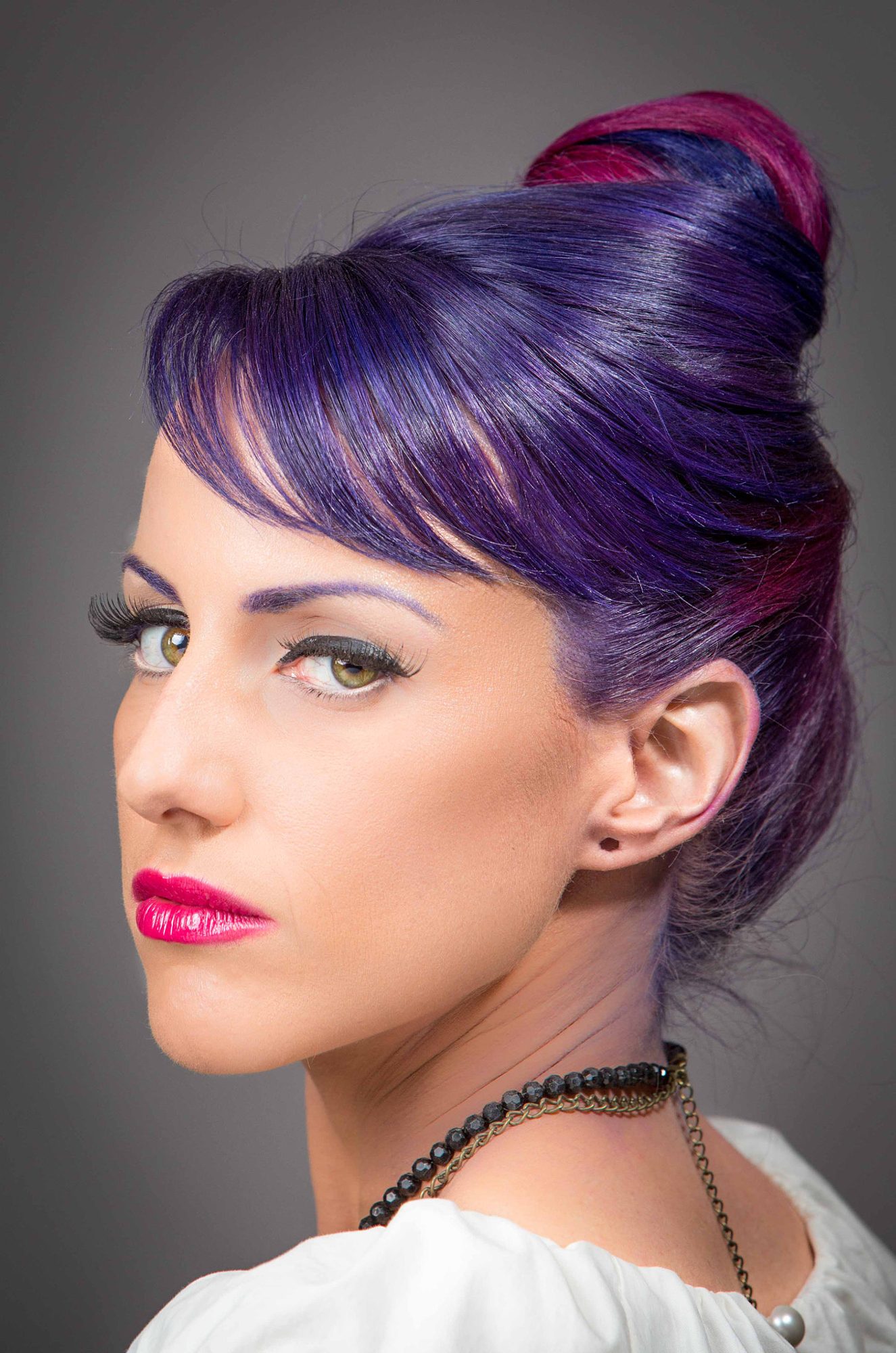 Portrait with sculpted purple updo