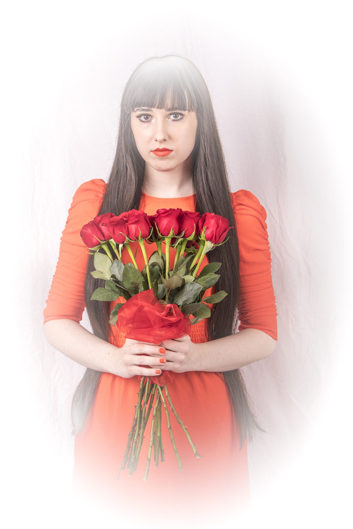 High-key portrait with red roses